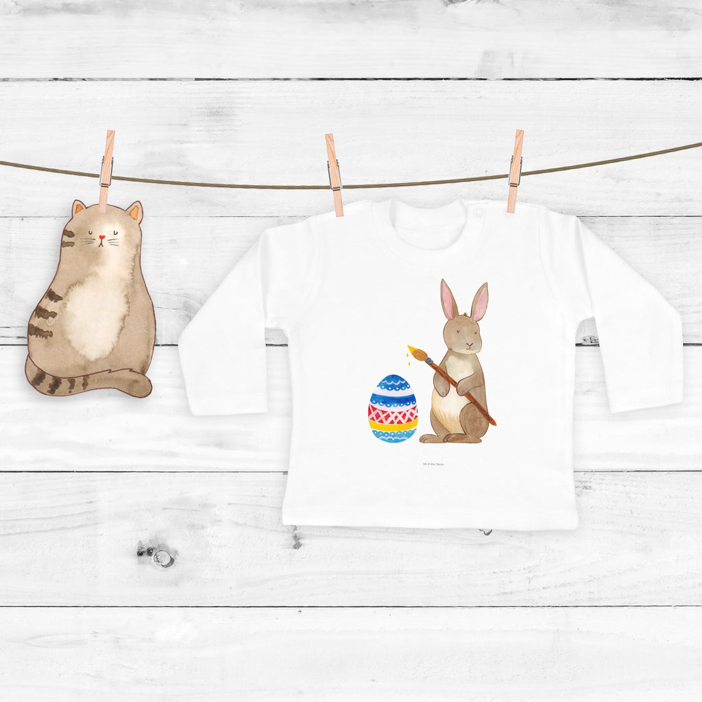6-12 Monate Baby Longsleeve Hase Eiermalen Mädchen, Jungen, Baby, Longsleeve, Langarm, Bio, Kleidung, uni, Langarmshirt, Ostern, Osterhase, Ostergeschenke, Osternest, Osterdeko, Geschenk zu Ostern, Frohe Ostern, Ostergrüße, Osterblume, Osterei, bemalte Ostereier, Hase, Kaninchen, Eiermalen