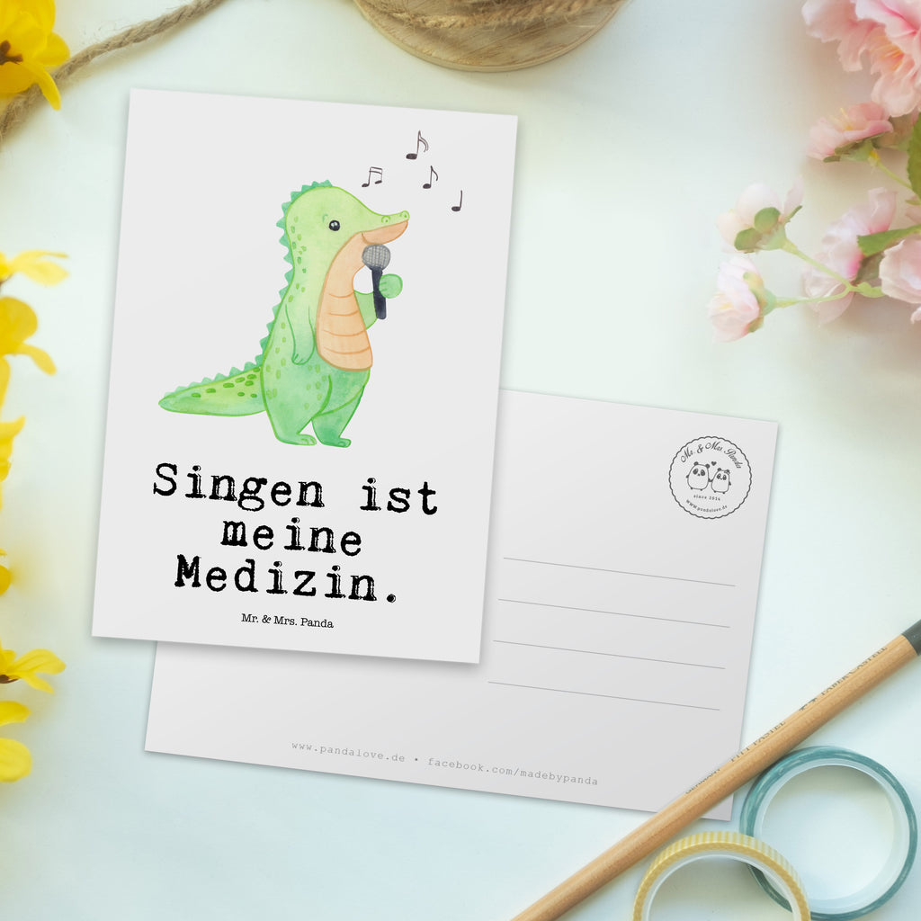 Postkarte Krokodil Singen Medizin Geschenkkarte, Grußkarte, Karte, Einladung, Ansichtskarte, Geburtstagskarte, Einladungskarte, Dankeskarte, Geschenk, Sport, Sportart, Hobby, Schenken, Danke, Dankeschön, Auszeichnung, Gewinn, Sportler, Singen, Band, Live Auftritt, Gesang, Hobbysänger