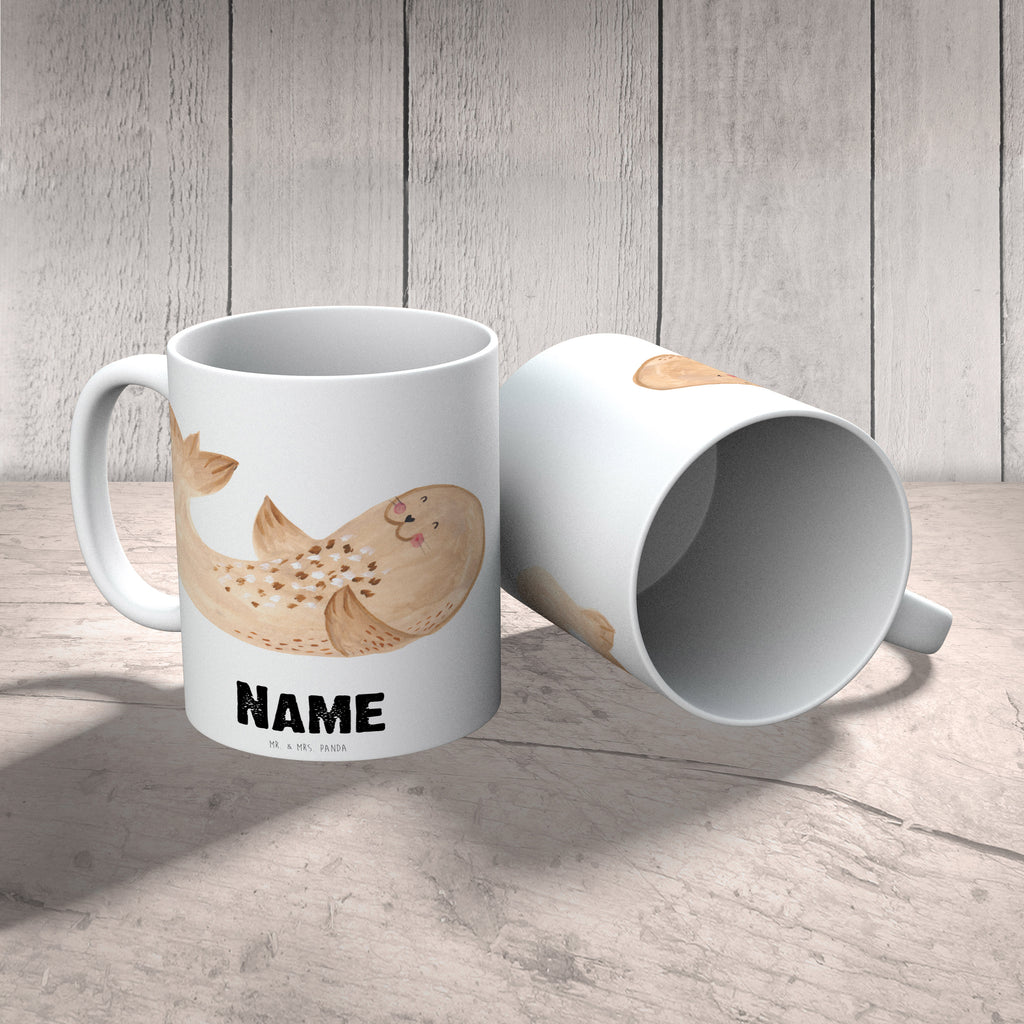 Personalisierte Tasse Robbe liegend Personalisierte Tasse, Namenstasse, Wunschname, Personalisiert, Tasse, Namen, Drucken, Tasse mit Namen, Tiermotive, Gute Laune, lustige Sprüche, Tiere, Robbe, Robben, Seehund, Strand, Meerestier, Ostsee, Nordsee, Lachen, Freude