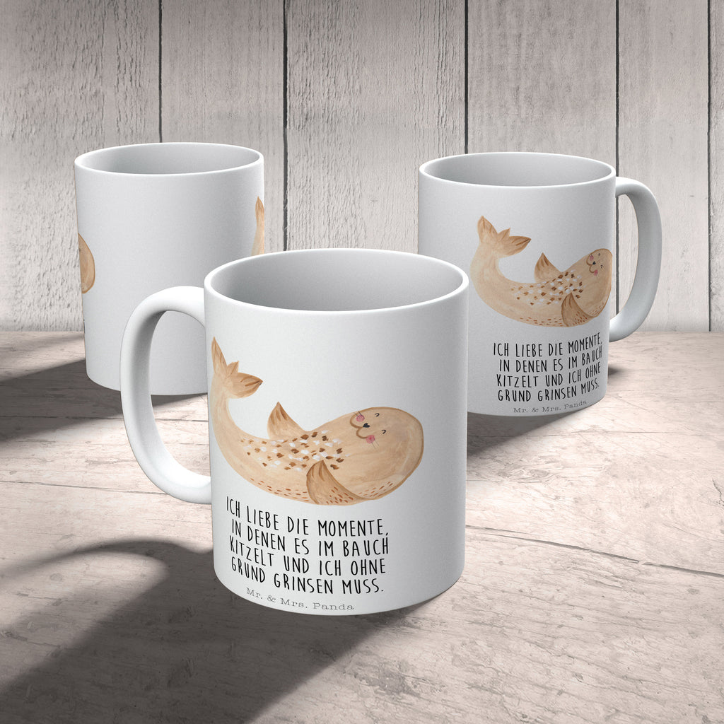 Tasse Robbe liegend Robbe, Robben, Seehund, Strand, Meerestier, Ostsee, Nordsee, Lachen, Freude Becher, Kaffeetasse, Kaffeebecher, Tee, Frühstück, Büro  süße Tiermotive, gute Laune, lustige Sprüche, Tiere