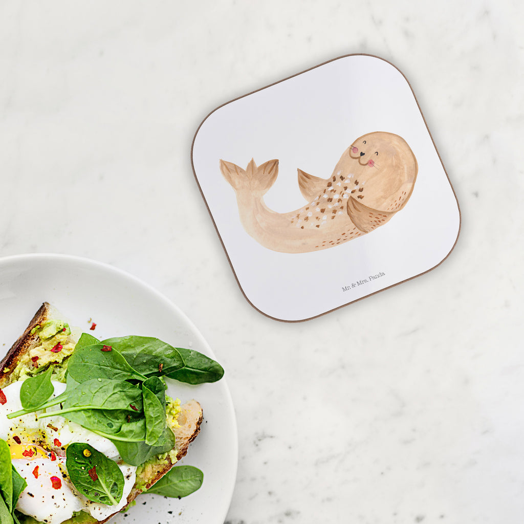 Quadratische Untersetzer Robbe liegend Bierdeckel, Glasuntersetzer, Untersetzer Gläser, Getränkeuntersetzer, Tiermotive, Gute Laune, lustige Sprüche, Tiere, Robbe, Robben, Seehund, Strand, Meerestier, Ostsee, Nordsee, Lachen, Freude