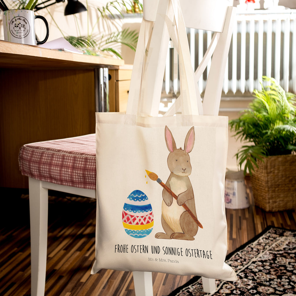 Tragetasche Hase Eiermalen Beuteltasche, Beutel, Einkaufstasche, Jutebeutel, Stoffbeutel, Ostern, Osterhase, Ostergeschenke, Osternest, Osterdeko, Geschenk zu Ostern, Frohe Ostern, Ostergrüße, Osterblume, Osterei, bemalte Ostereier, Hase, Kaninchen, Eiermalen
