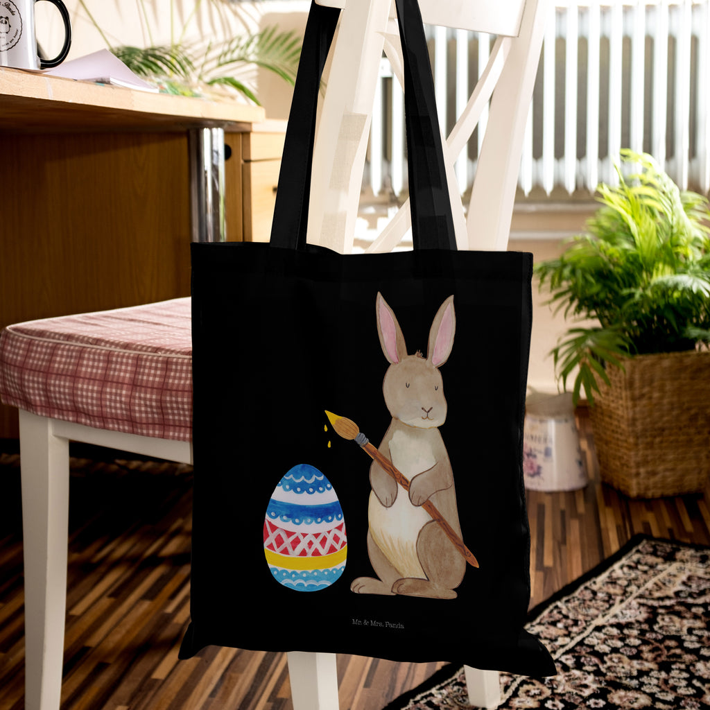 Tragetasche Hase Eiermalen Beuteltasche, Beutel, Einkaufstasche, Jutebeutel, Stoffbeutel, Ostern, Osterhase, Ostergeschenke, Osternest, Osterdeko, Geschenk zu Ostern, Frohe Ostern, Ostergrüße, Osterblume, Osterei, bemalte Ostereier, Hase, Kaninchen, Eiermalen