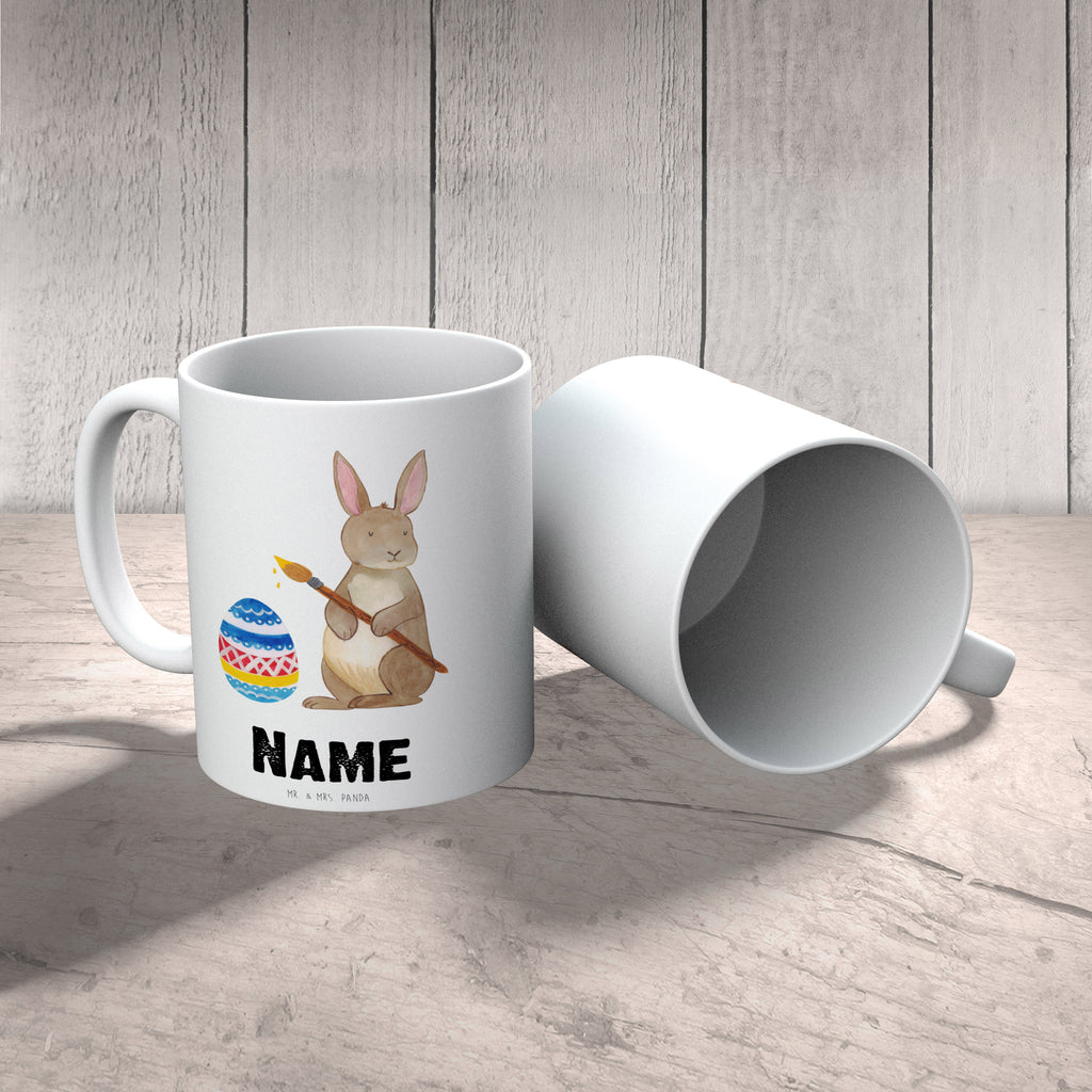 Personalisierte Tasse Hase Eiermalen Personalisierte Tasse, Namenstasse, Wunschname, Personalisiert, Tasse, Namen, Drucken, Tasse mit Namen, Ostern, Osterhase, Ostergeschenke, Osternest, Osterdeko, Geschenk zu Ostern, Frohe Ostern, Ostergrüße, Osterblume, Osterei, bemalte Ostereier, Hase, Kaninchen, Eiermalen